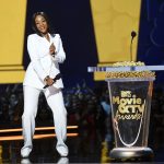 SANTA MONICA, CA - JUNE 16: Host Tiffany Haddish speaks onstage during the 2018 MTV Movie And TV Awards at Barker Hangar on June 16, 2018 in Santa Monica, California. (Photo by Kevin Winter/Getty Images for MTV)