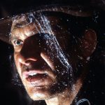 Harrison Ford walks through cobwebs in a scene from the film 'Indiana Jones And The Last Crusade', 1989. (Photo by Paramount/Getty Images)