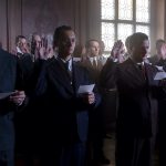 Twelve good men and true: a dozen background cast, who work in repeat performance throughout the season, take the oath as the trial’s jury members. Courtesy Merrick Morton/HBO