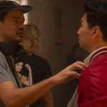 (L-R): Director Destin Daniel Cretton and Simu Liu on the set of Marvel Studios' SHANG-CHI AND THE LEGEND OF THE TEN RINGS. Photo by Jasin Boland. ©Marvel Studios 2021. All Rights Reserved.